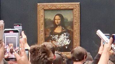 Леонардо Да-Винч - Мона Лиза - Нападение на Мону Лизу: «старушка» метнула в Джоконду тортом - fokus-vnimaniya.com